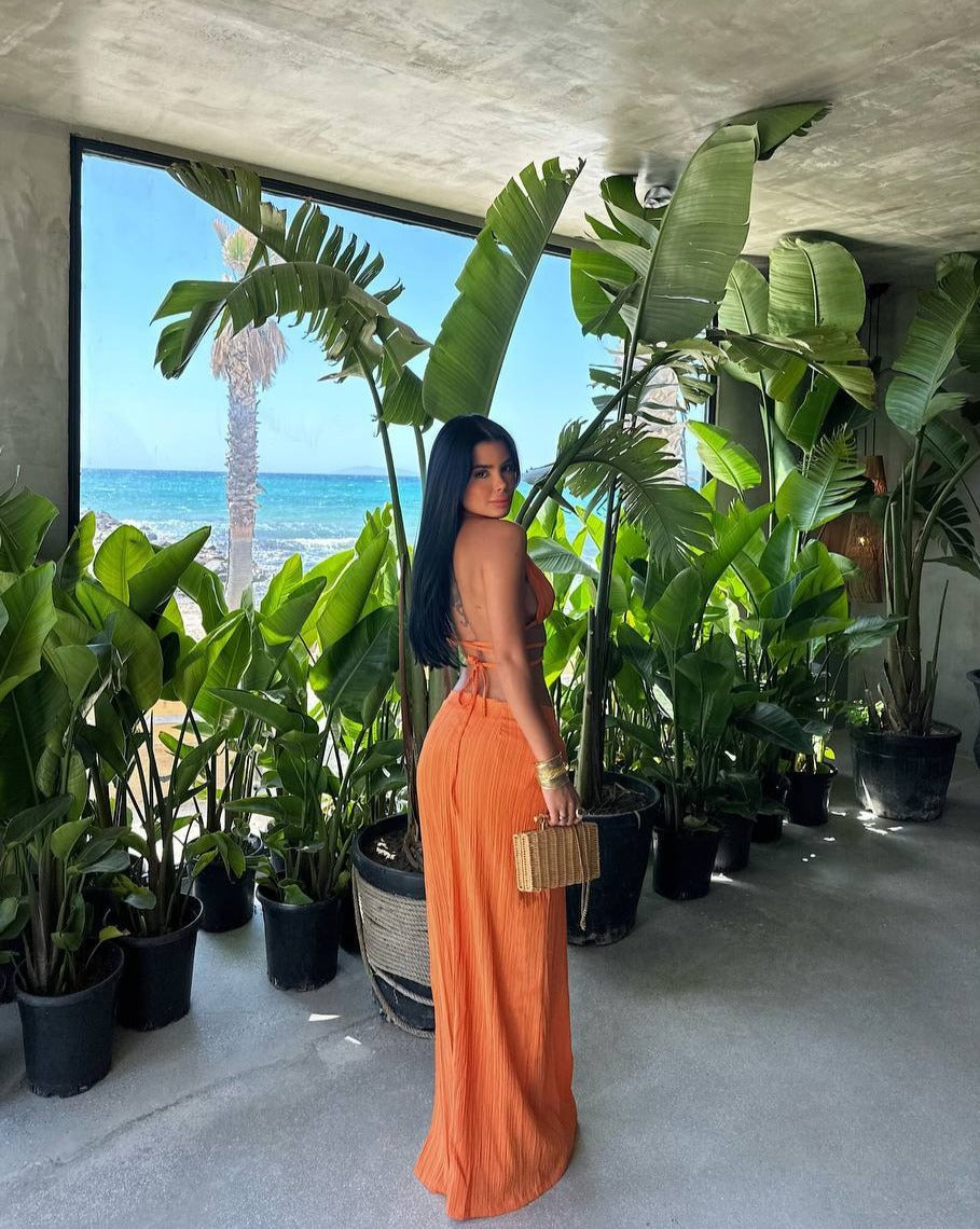 back view of the Tropical Chic Set in orange, displaying the half-lined, zippered skirt.