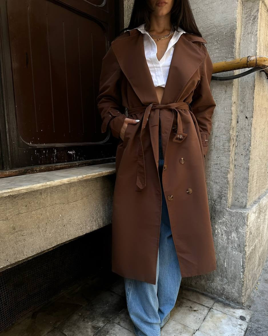Close-up of the waist-defining belt detail on Mutu's Aisha Brown Trench Coat.
