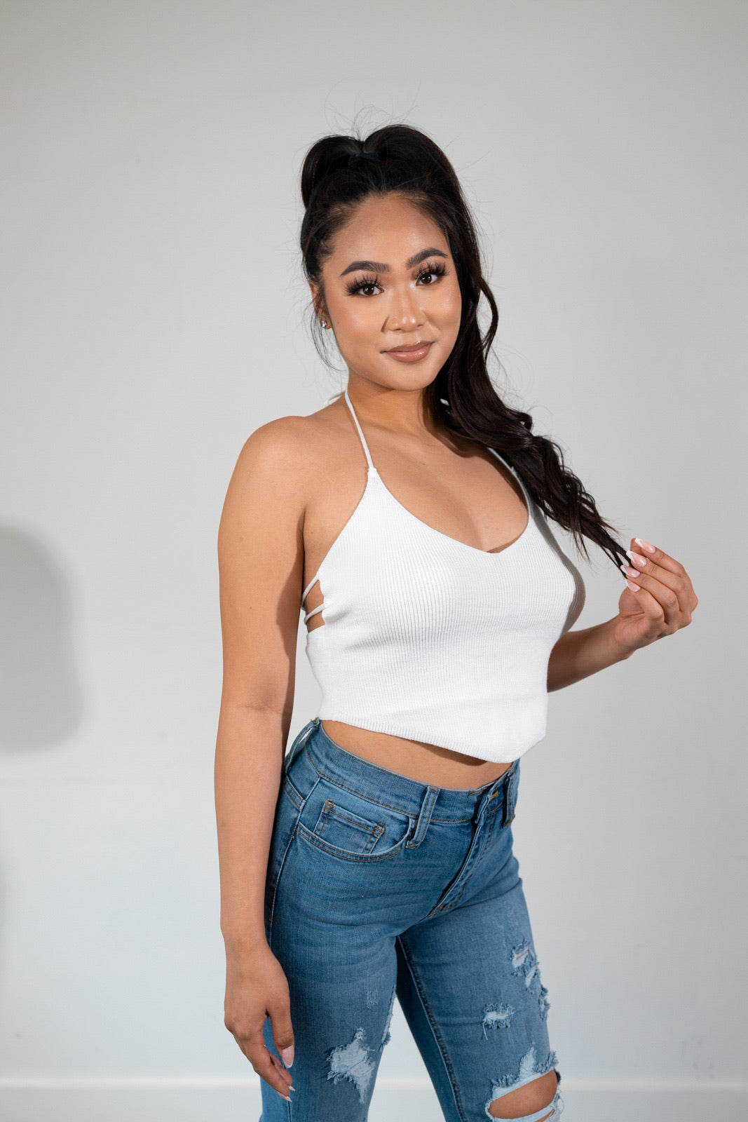 Soft knit halter top with open back ties in white