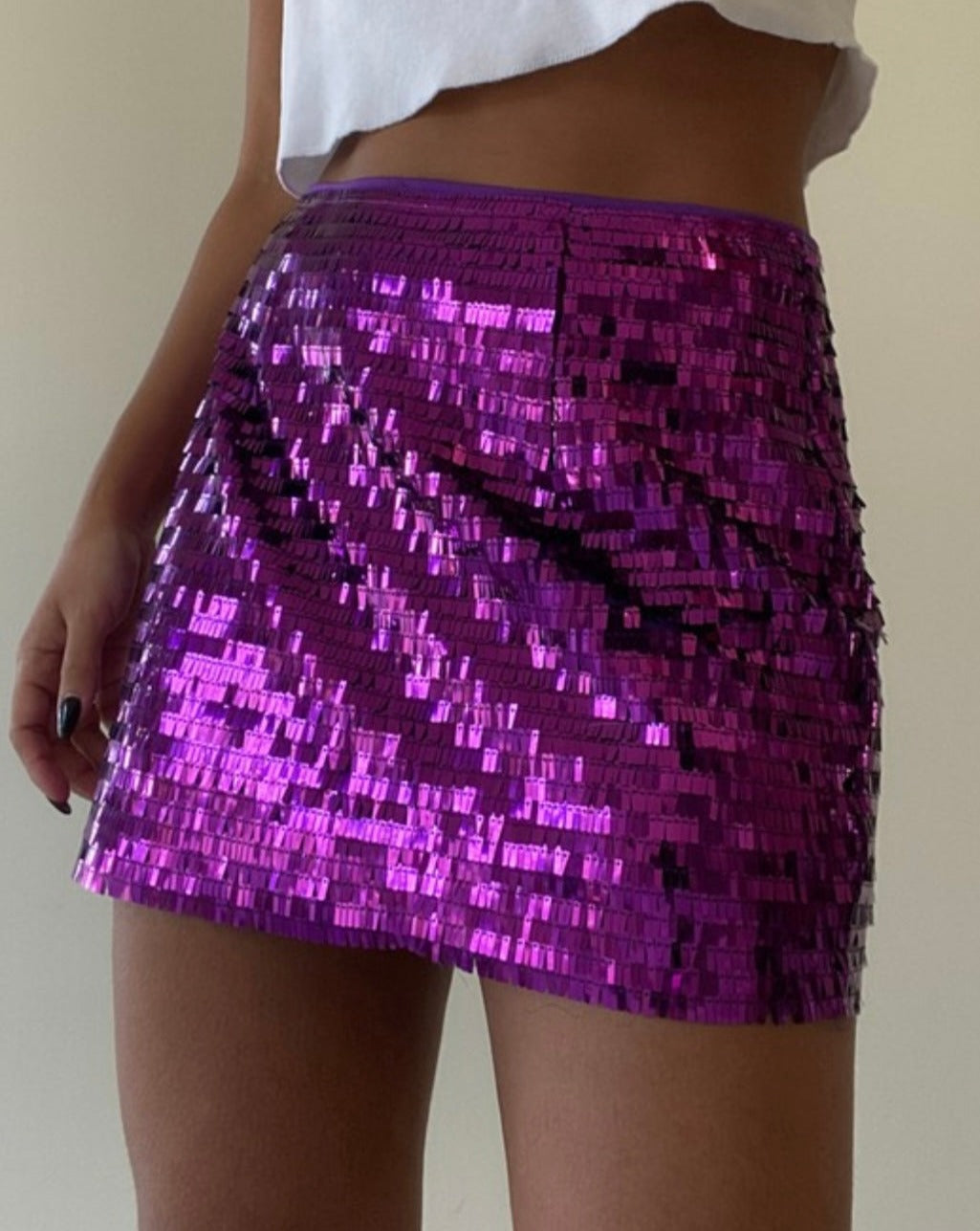 Pair the grape Kimmy Sequin Low Waist Mini Skirt with your favorite top for a captivating look