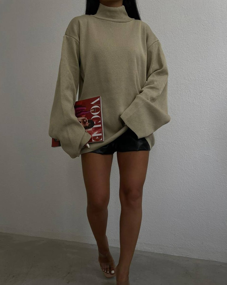 Close-up of the Alice Sweater's soft ribbed stretch fabric and unique flywheel sleeve design