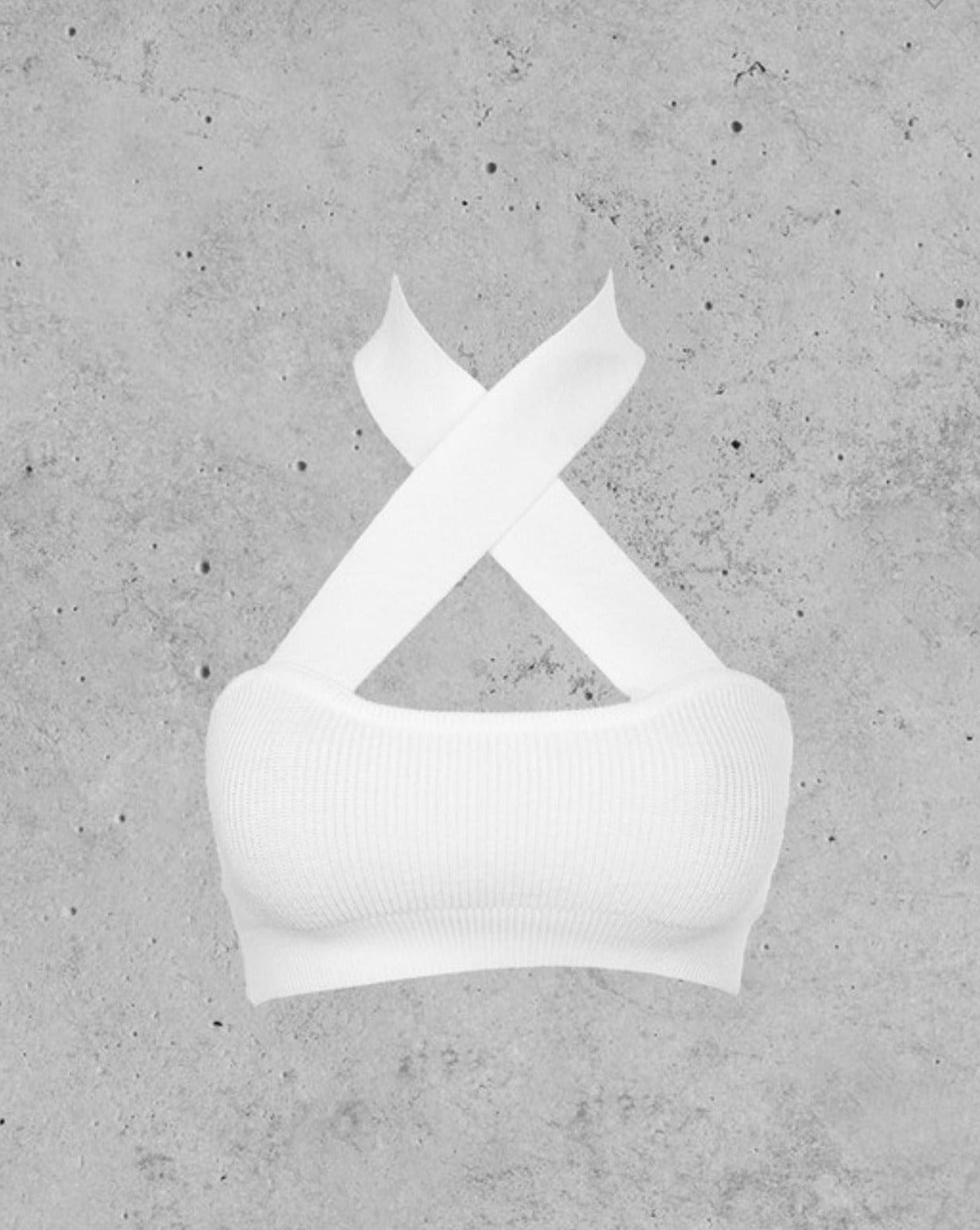 White Knit Rib Halter Twist Crop Top, showcasing the stylish halter twist detail and body-hugging rib fit.