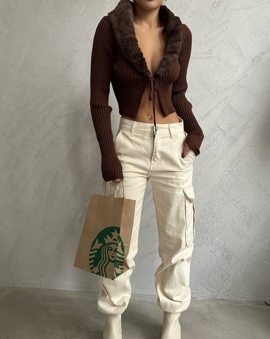 Brown knit ribbed long sleeve cardigan style crop top with front tie adjustable detail and luxurious faux furry neckline. Made of 100% acrylic. Perfect for dressing up or down. Shop now and elevate your wardrobe.