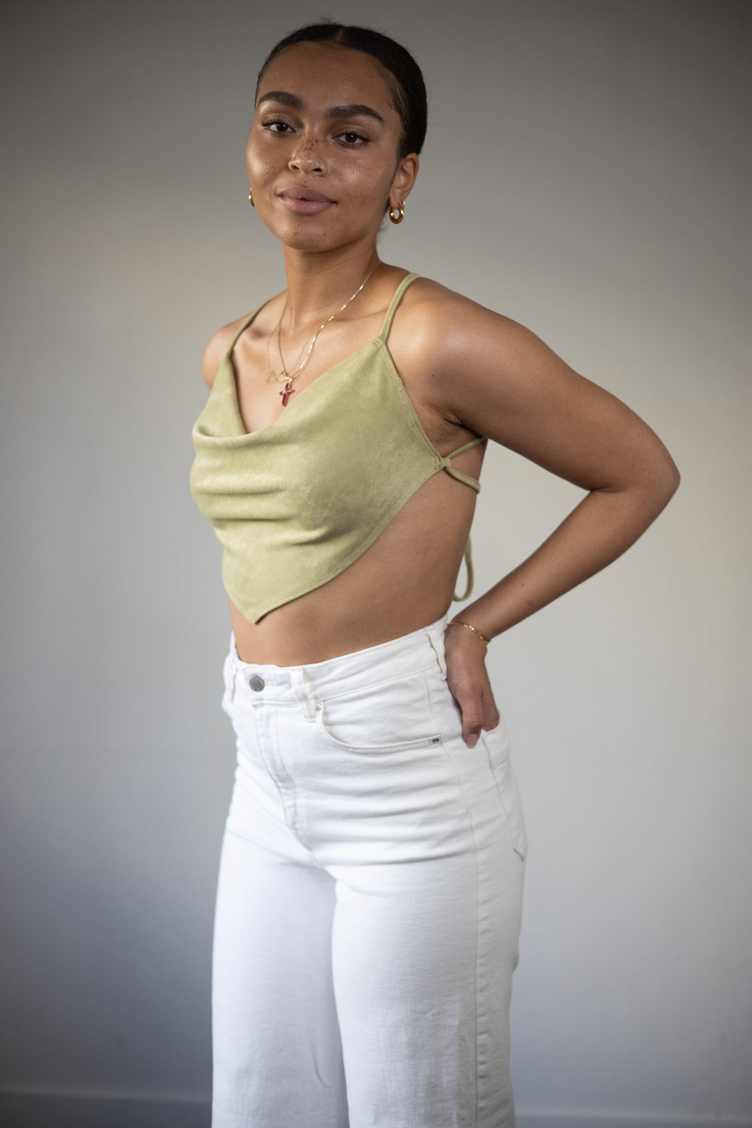 Trendy jade green open tie back crop top with jeans