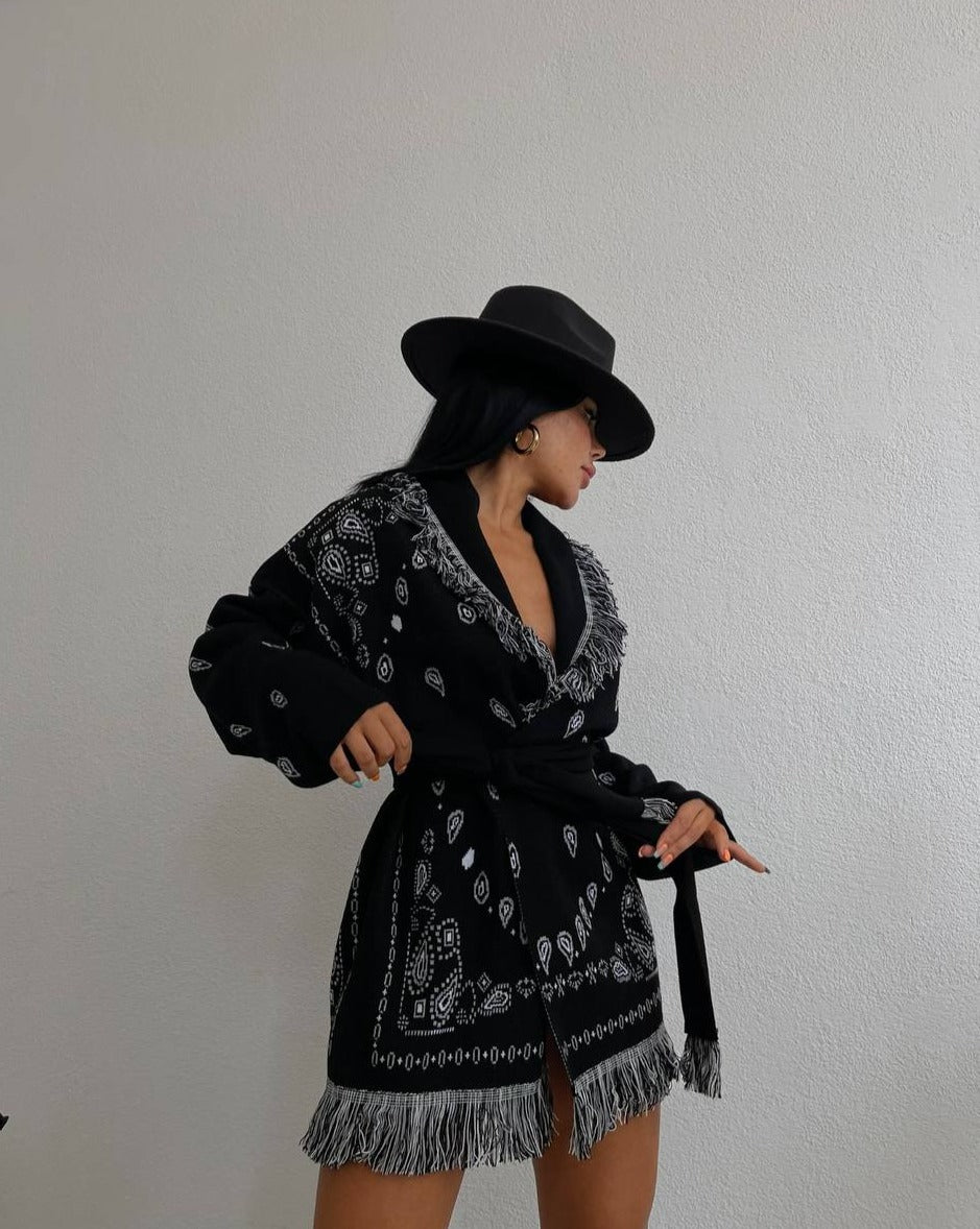 Woman wearing the RUE Jacquard Graphic Pattern Shawl Cardigan, styled with jeans and knee-high boots for a casual chic look
