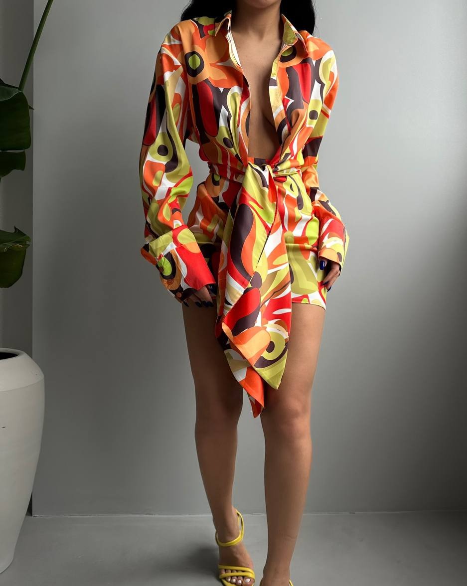 Model flaunting the fashionable and comfortable Vibrant Retro Garden Bound Mini Dress with stylish long sleeves