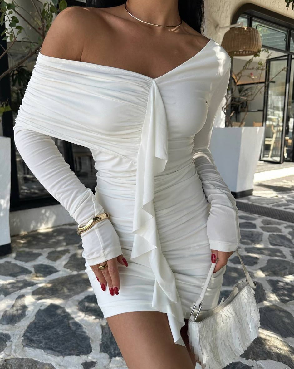 Front view of the White Ruffle Detail Mini Dress, crafted from sandy fabric. The dress features an elegant ruffle detail and is shown in size S. Measurements: dress length 60 cm, bust 35 cm. Model's measurements: 160 cm height, 50 kg weight, 80 cm chest, 62 cm waist, 94 cm hips."