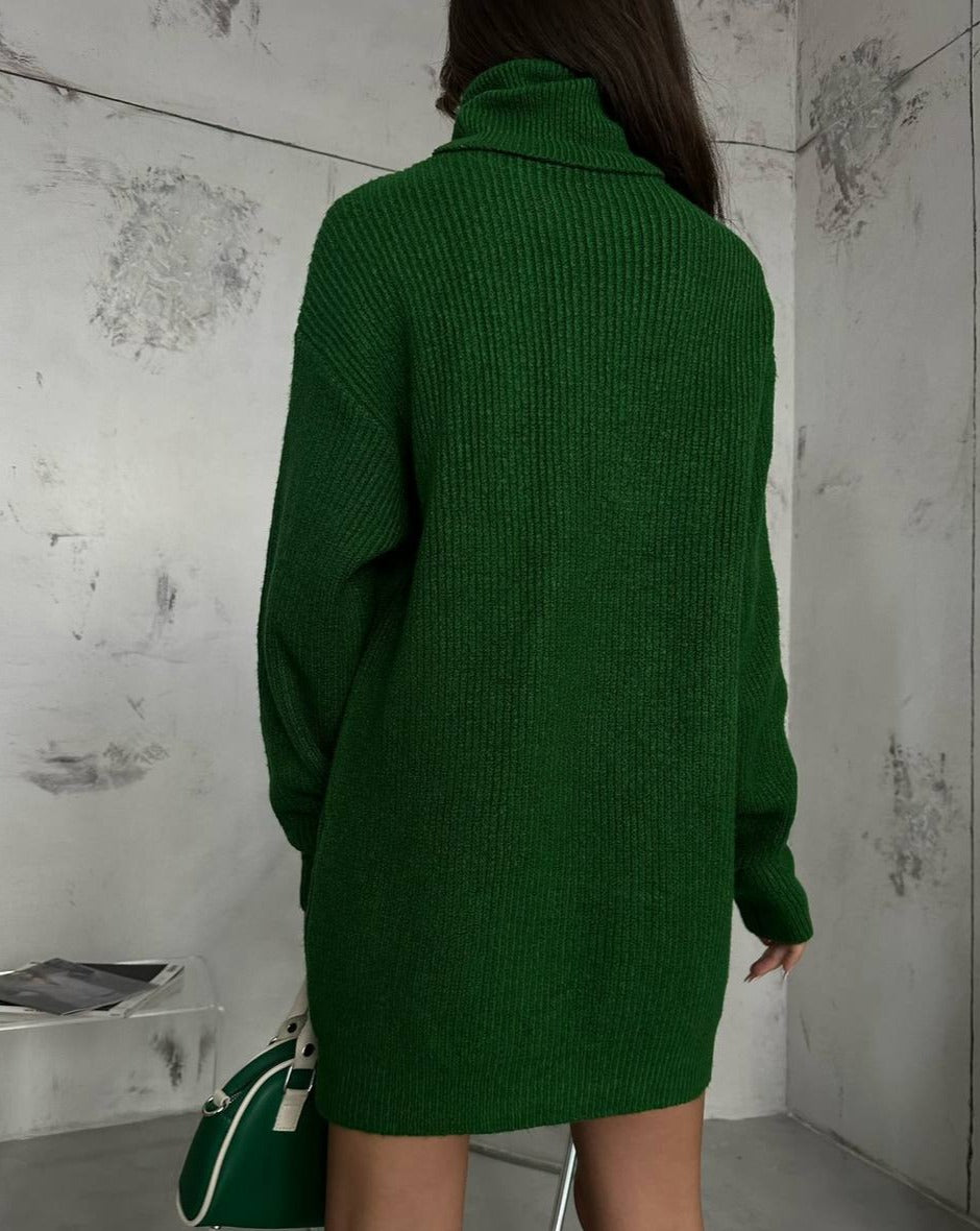 Back perspective of the Kai Green Turtleneck Sweater Tunic Mini Dress, illustrating the relaxed oversized silhouette, a chic choice available at Mutu shop.