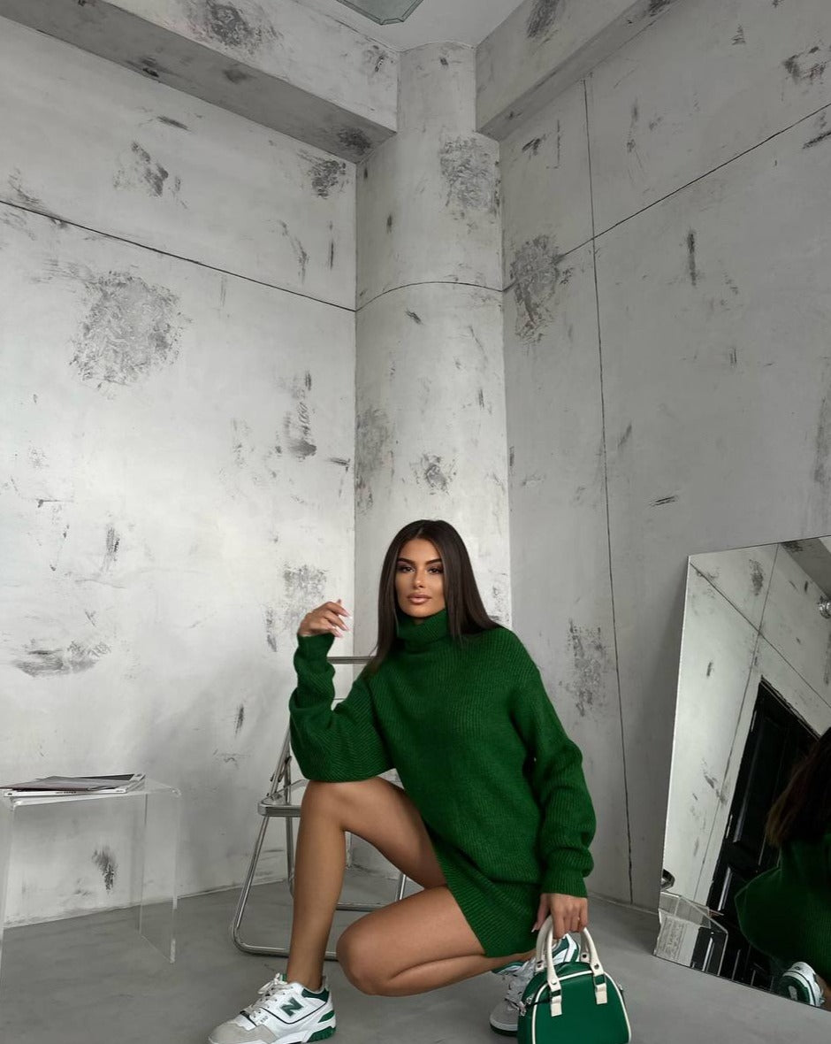 Detail perspective of the Kai Green Turtleneck Sweater Tunic Mini Dress, spotlighting the quality fabric and fine craftsmanship, only at Mutu.shop