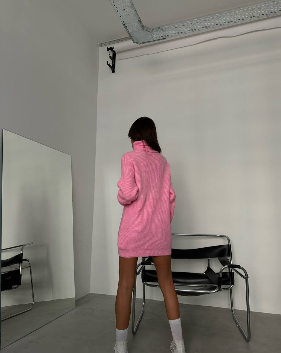 "Back view of the Kai Pink Turtleneck Sweater Tunic Mini Dress, illustrating the relaxed oversized silhouette, a unique find at Mutu shop.