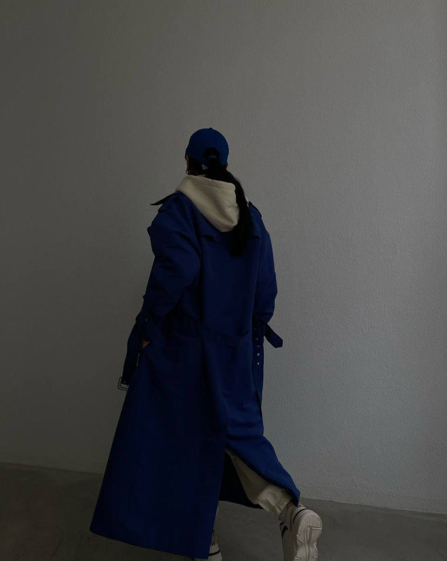 Back view of the Aisha Blue Trench Coat by Mutu, a must-have for the 2023 fall wardrobe