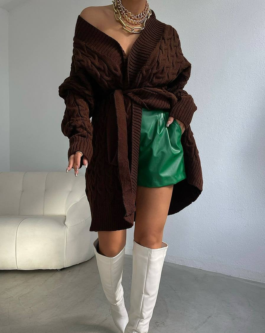 Woman wearing Lori Oversized Chunky Knit Cardigan in brown, styled with shorts and a casual top