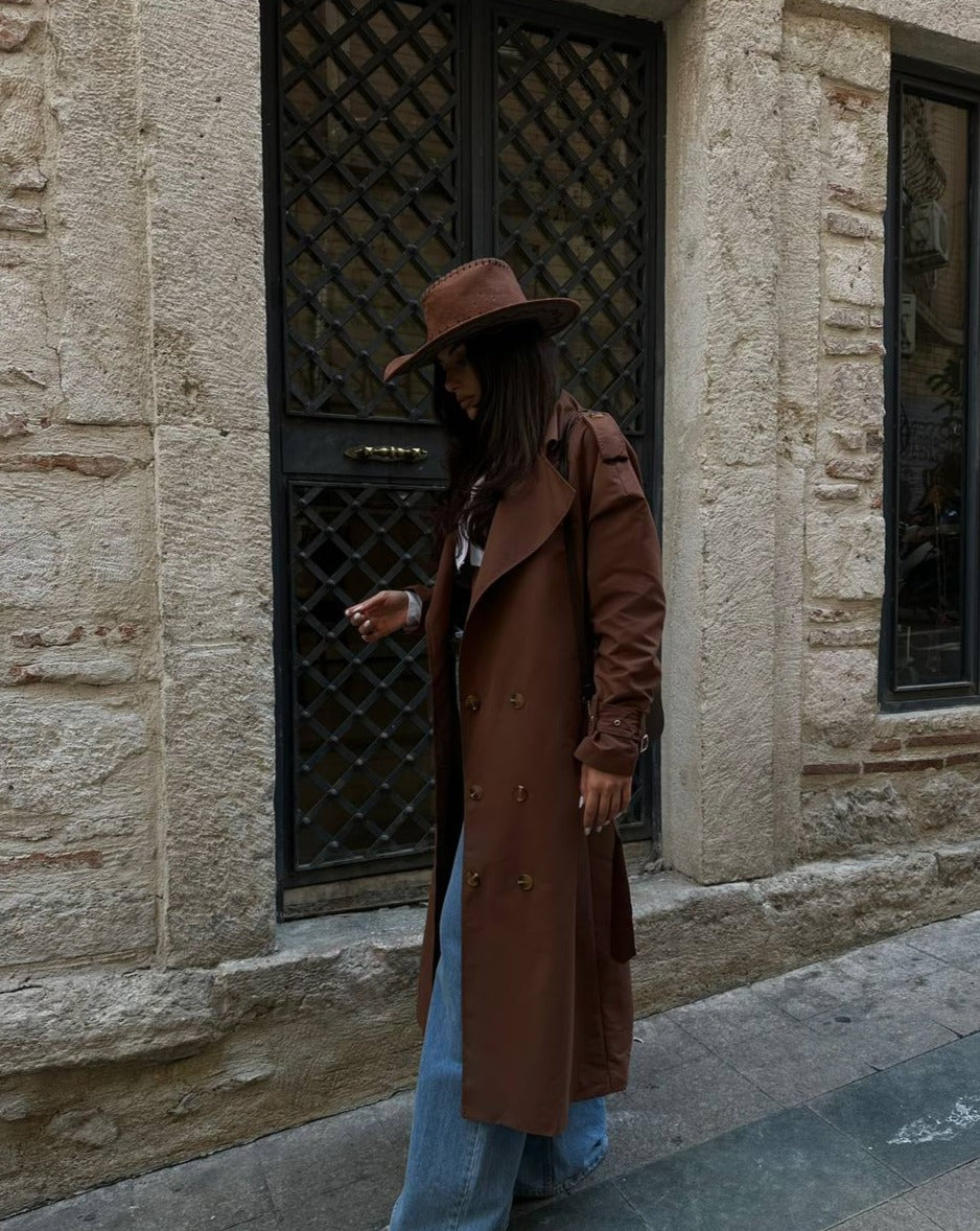 Detailing of the pronounced lapel collar and button-down front on Mutu's Aisha Brown Maxi Coat.
