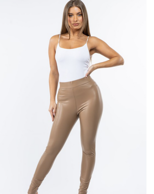 Model showcasing the Val Cappuccino High Waisted Faux Leather Leggings, highlighting the chic design and flattering fit.