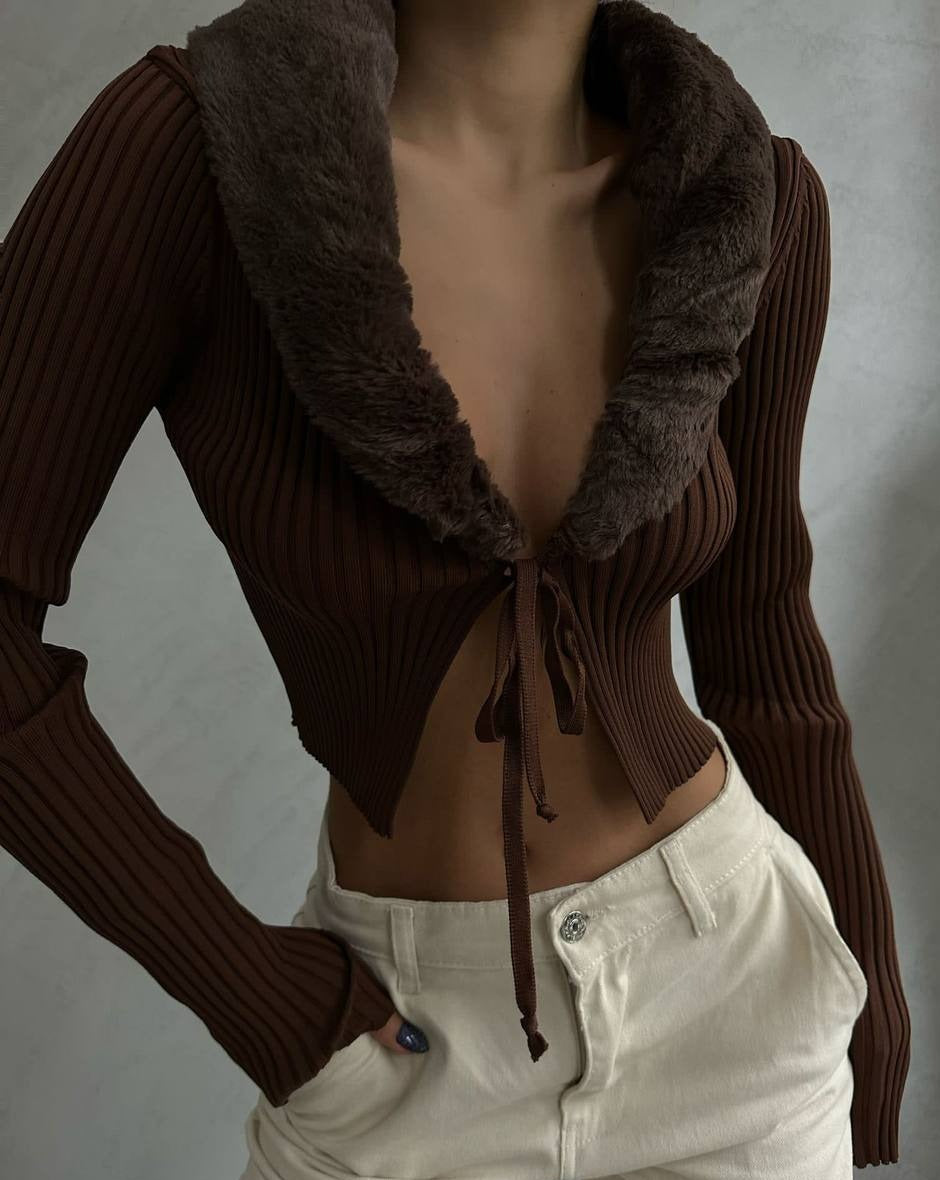 Brown knit ribbed long sleeve cardigan style crop top with front tie adjustable detail and luxurious faux furry neckline. Made of 100% acrylic. Perfect for dressing up or down. Shop now and elevate your wardrobe.