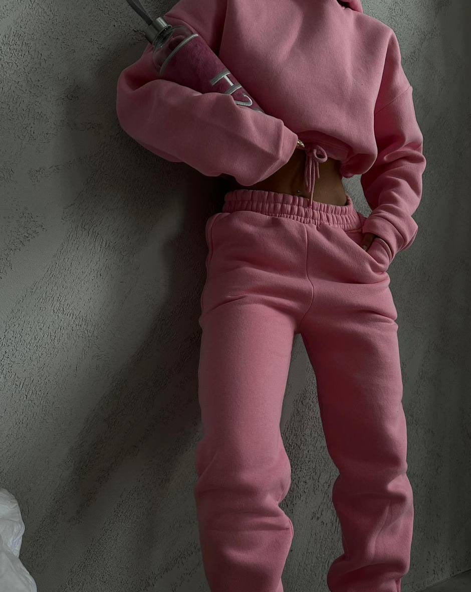 Pink oversized sweat set with drawstring hem and hoodie-style crewneck. Made of soft 100% cotton for all-day comfort. Responsibly made in Turkey.