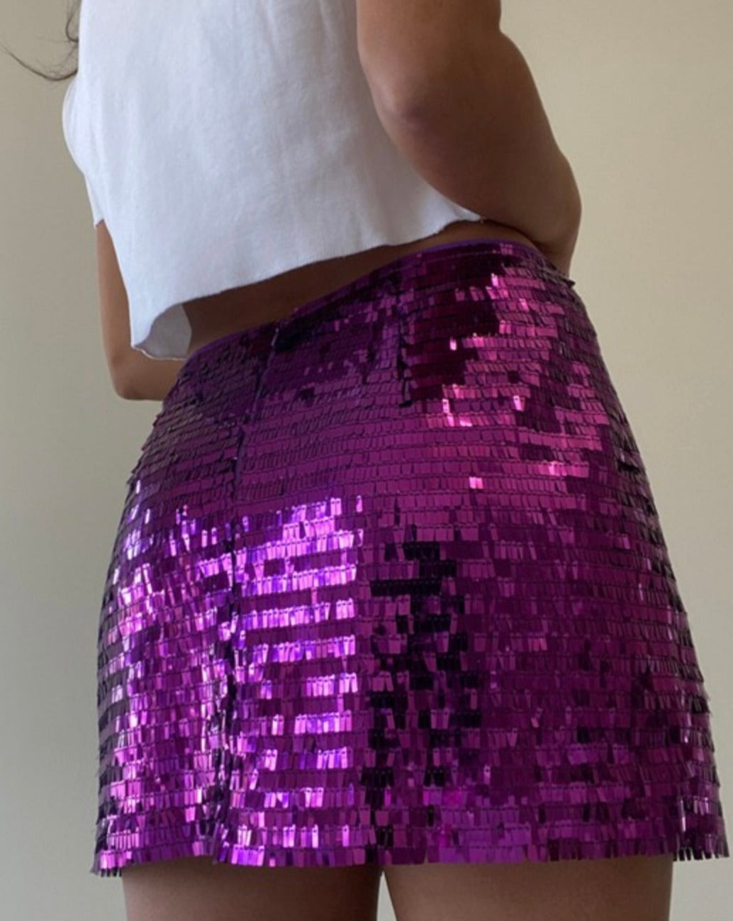 Side view of model wearing grape Kimmy Sequin Low Waist Mini Skirt