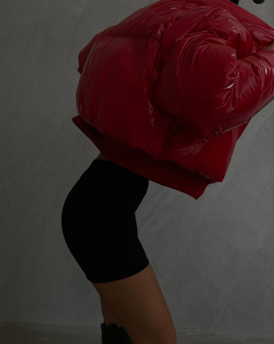 Stylish and oversized red DEVI patent puffer jacket perfect for winter