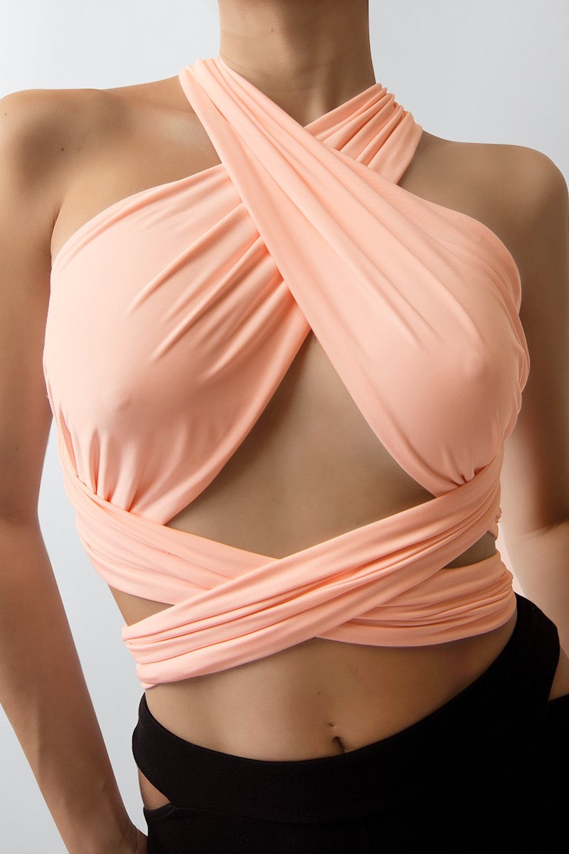 Close-up of the Cydney Peach Wrap Around Crop Top, highlighting its versatile design and soft, comfortable fabric.
