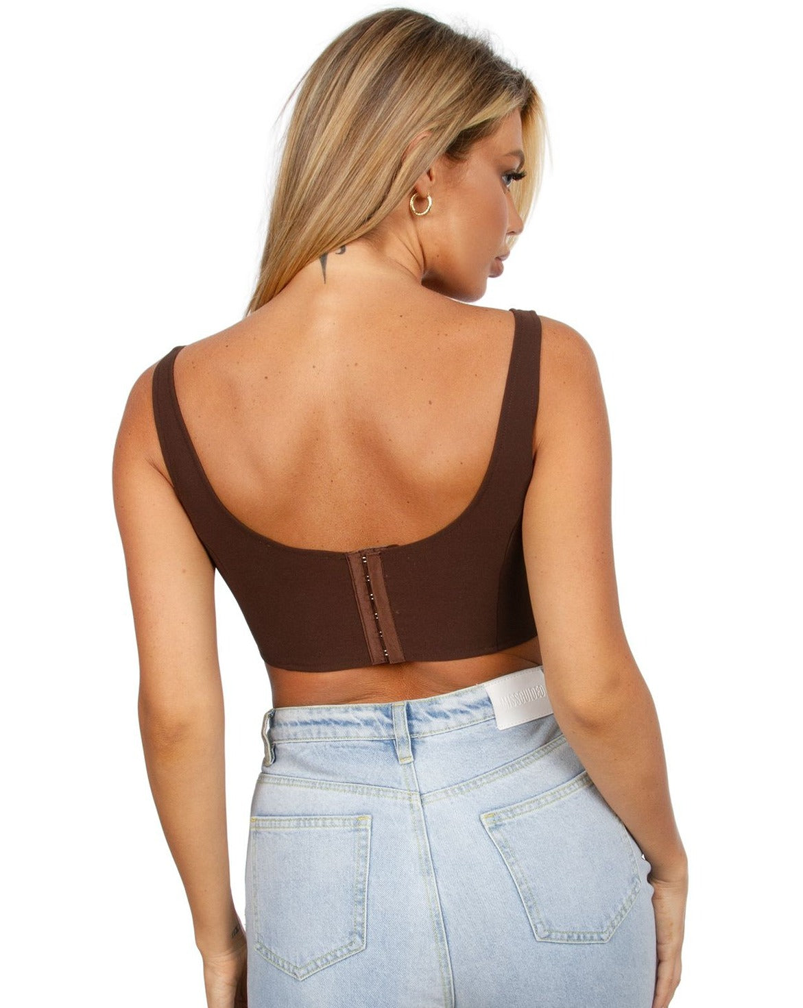 Close-up view of the angled cut-out underbust design and back hook and eye closure on the Draya Brown Crop Top.
