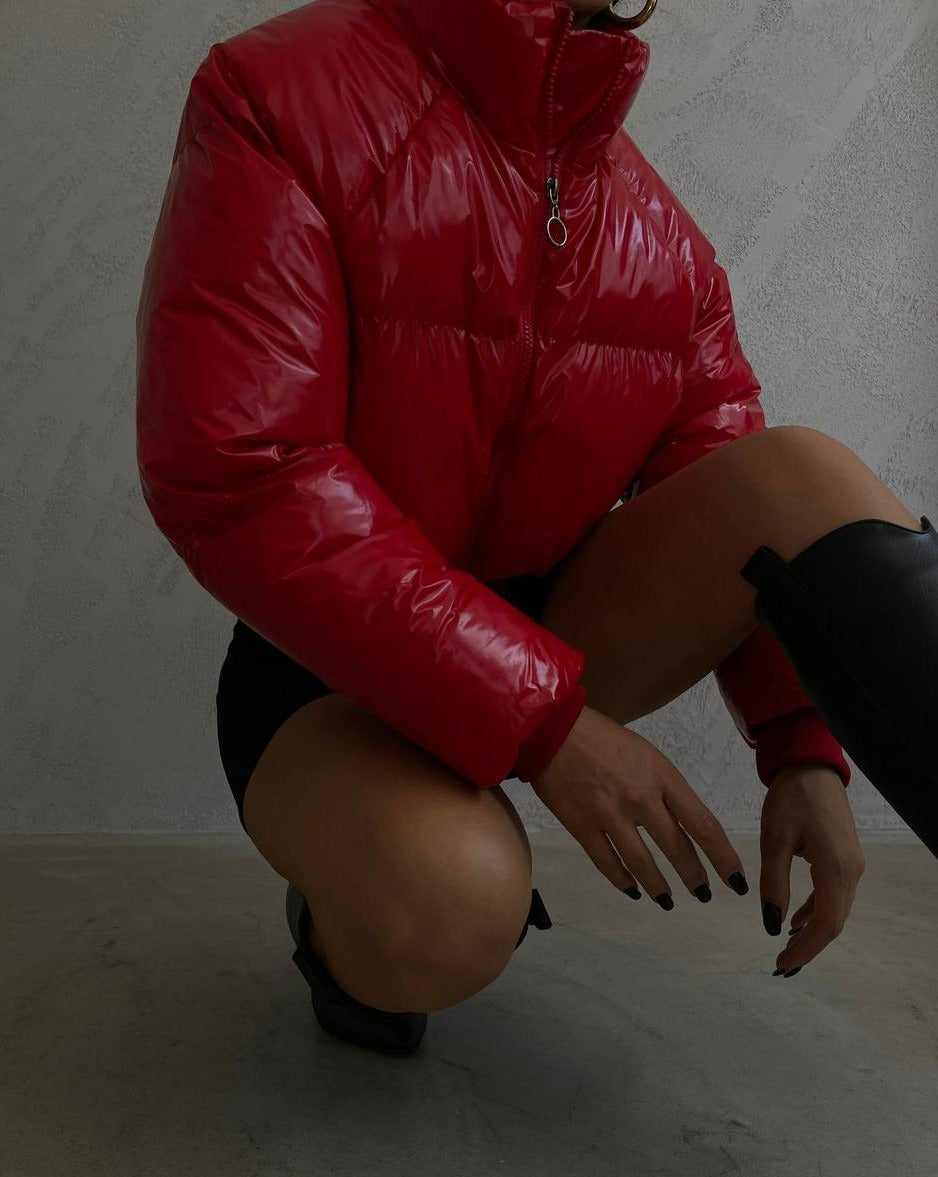 Close-up of front zip closure on red DEVI puffer jacket